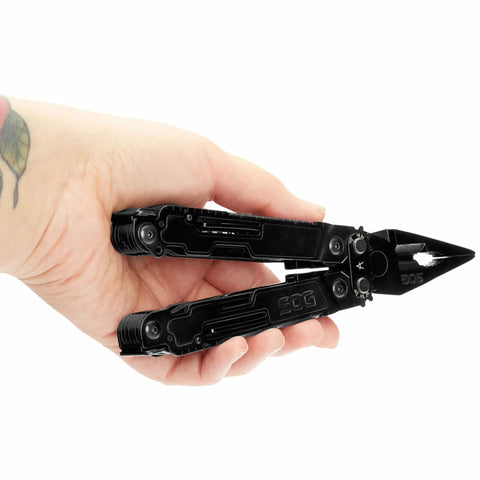 Hand holding PowerAccess Deluxe All Purpose Heavy Duty Stainless Steel Multi Tool With Nylon Sheath Twenty One Tools Two Knife Blades