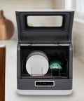 Sleek Stainless Steel Portable Countertop Dishwasher with 8L Built-In Water Tank and Tough Rust-Resistant Build Featuring Three Wash Modes, open with dishes inside.