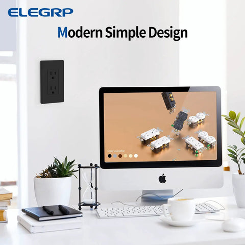 Dope Matte Black Decorator Electrical Wall Receptacle Outlet 15A 125V shown next to modern desktop setup