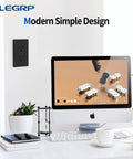Dope Matte Black Decorator Wall Receptacle Outlet 15A 125V NEMA 5 15R Non Tamper Resistant Self Grounding next to desktop