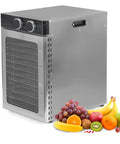 Badass Electric Food Dehydrator With 12 Stackable Trays And A Slam Dunk 1200W Motor showcasing fruits beside a stainless steel unit.