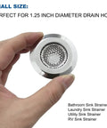 Hand holding a 1.25 Inch Drain Strainer Stainless Steel Mesh Basket, suitable for various sinks and drain holes.