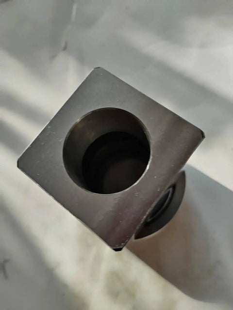 ER40 Quad Chuck System With Four-Sided Square Block For Rock-Solid Stability, Requires ER40 Collet Chuck Fitment For Secure Tool Holding And Precision Machining, Heavy-Duty Four-Corner Body Design; close-up view of square block.