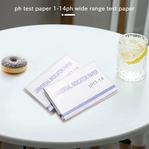 All Purpose PH Test Strips Kit Two Pack With Control Card 1 To 14 Range on a table with a drink and donut