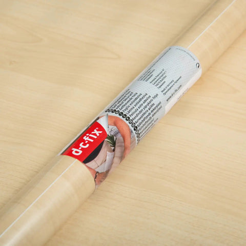 Maple Wood Decorative Self Adhesive Film 17 Inch By 78 Inch Roll, Easy Peel And Stick Wallpaper in packaging on table.