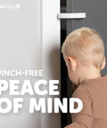 Child interacting with a door fitted with Snaps Right On Eva Foam Door Pinch Guards And Slam Blockers for safety.