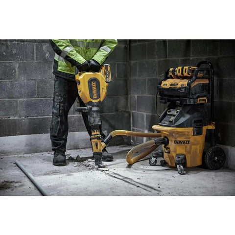 High Power 60V Brushless Cordless Chipping Hammer With SDS Max Chuck and Rear Handle Setup in action on concrete floor.