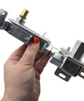 Hand holding Gas Safety Valve Replacement For Range Oven Model Specific Thermal Bimetal Gas Control With Dual Outlets Fits 316404901