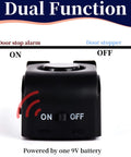Front view of a black door stop alarm device; wedge-shaped with ON/OFF switch, 9V battery powered.