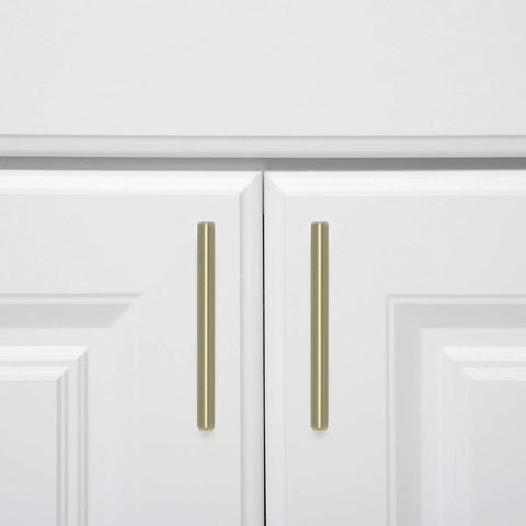 Golden Champagne Euro Bar Cabinet Pulls Five And Three Eighths Inch Length 3 Inch Hole Center One Half Inch Diameter Ten Pack on white cabinet doors.