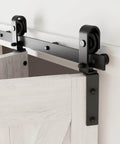 Bi-Folding Sliding Barn Door Hardware Kit For Two Doors with black track and J-shape rollers, installed on wooden panel
