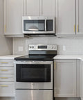 Modern kitchen with 30 Pack 5 Inch Square Cabinet Handles In Brushed Brass Finish Stainless Steel Kitchen Hardware Pulls With 128mm Hole Center Designed For Cabinets Wardrobes Chests And Cupboards Gold, installed on grey cabinets.