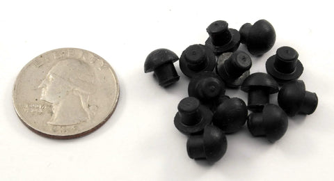 Small Rubber Push In Mushroom Bumpers Set Of Eight For Three Sixteenth Inch Openings With Eleven Thirty Seconds Of An Inch Diameter Durable Bumpers next to a coin for scale.