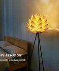 Boho Lotus Flower Floor Lamp With Tripod Stand beside bed, cozy glow and chill vibe, soft glare free light for bedroom and living room.