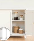 Open cabinet showing jars with six inch cabinet door stops and hinge limiters, stainless steel, to protect door opening angle.