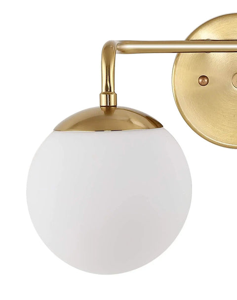 Gold Finish 15 Inch Globe Wall Sconce Vanity Light With White Frosted Glass Shade For Bathroom in modern midcentury Parisian bistro vibe.