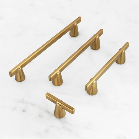 Gold Cabinet Handles 3 Inch 76mm Pack Of 3 Minimalist Modern Dresser Pulls with conical bases displayed on marble surface