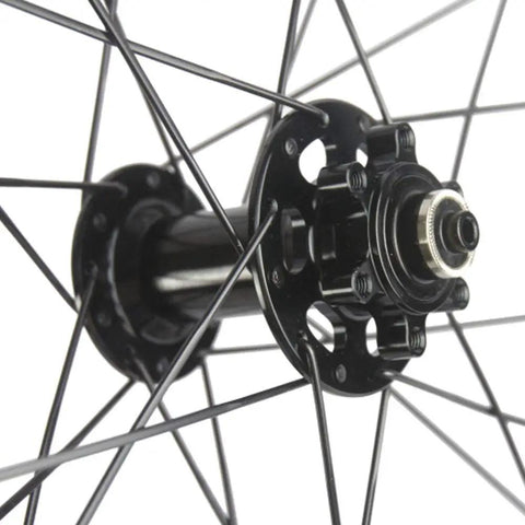 Close-up of front hub on Carbon Fiber Disc Brake Wheelset 700C Clincher Tubeless Ready 45mm Deep 25mm Wide UD Matte Finish Six Bolt
