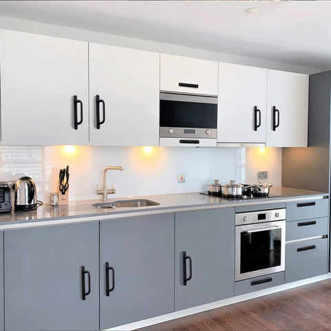 Kitchen with gray and white cabinets featuring 12 Pack Matte Black Cabinet Pull Handles With Base Plate Aluminum Alloy, 5 Inch Hole Center