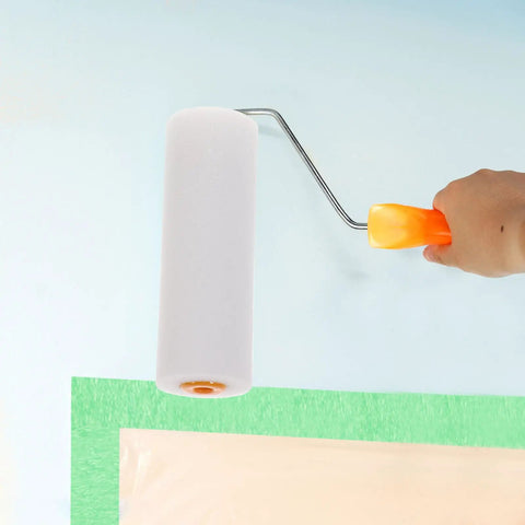 Person using a mini foam paint roller cover on a wall, part of 10 Pack High Density Foam Paint Roller Covers Mini Wall Paint Rollers Quick And Dirty Setup Knockout Coverage For Water Based And Oil Based Paints Gloss Stains Real Smooth Finish Home Workshop Needs.