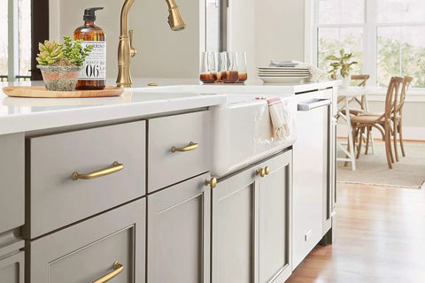 Champagne Bronze Cabinet Knob 1-1/4 Inch Diameter For Cabinets And Drawers, Renown Series in kitchen on gray cabinetry