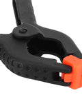 Top Tier 10 Piece Spring Clamps For Woodworking And DIY Projects With Ergonomic Handles That Grip Hard To Hold Boards Securely While You Paint Build Crafts Or Work In Your Studio Without Any Slip Ups On This Ultimate Hand Tool Kit. black plastic spring clamp with orange tip