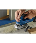 User cutting wood with 18V Brushless Top Handle Jig Saw With 3500 No Load Strokes Per Minute Die Cast Aluminum Footplate With No Mar Overshoe Variable Speed Control 0 To 3500 SPM Bare Tool For Pros