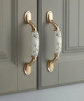Ceramic Door Knobs Set, 2 Pcs Retro Furniture Handle, Vintage Antique Drawer Pulls Cupboard Knob, Cabinet Pull Handles, Zinc Alloy With Ceramic Accent, 3-3/4 Inch Hole Centers installed on grey cabinet doors.