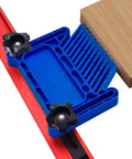 Workhorse Stackable Featherboard Rig For Table Saw Router And Bandsaw With Tight Lock Anti Kickback Bar T Track Mount Blue Grip Handles No Sweat Setup, blue handle featherboard attached to T-track with wood block.