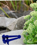Heavy Duty 4.72 Inch Hand Clamp Vise For Woodworking And Metalworking Portable Steel With Fastening Knob And Slip Resistant Grip For Pro Grade Hold And Ideal For Home Shop Use With Precise Project Finishes. Blue hand clamp vise on rock outdoors