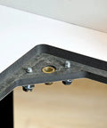 Close-up of Heavy Duty Solid Phenolic Router Table Top with Tight Ten Point Plate Leveling Rig and metal screws.