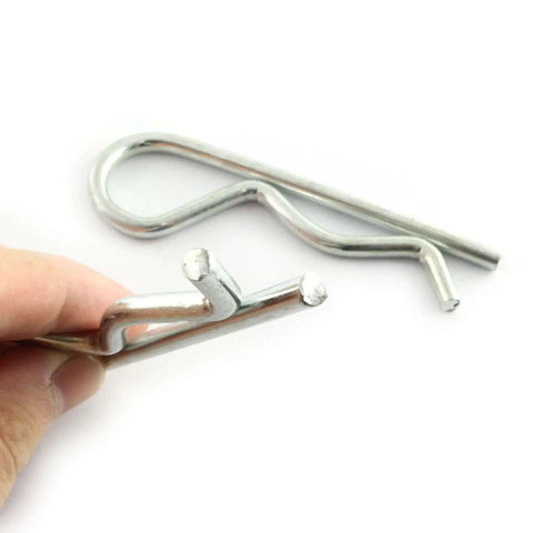 Hand holding 2 Pack Stainless Steel R Clips Hairpin Cotter Pins For Quick Securement M5x100 Zinc Coated For Outdoor And Indoor Use