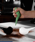 Hand using Dope Bird Inspired Coffee Air Blower Air Duster For Espresso Machines And Delicate Electronics Removable Pump Cleaning Tool In White