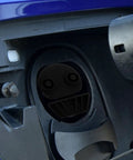 Universal Silicone EV Charging Port Covers in a black protective cap fitting snugly into an EV charging socket.