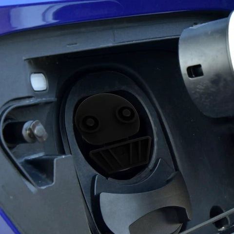 Universal Silicone EV Charging Port Covers in a black protective cap fitting snugly into an EV charging socket.