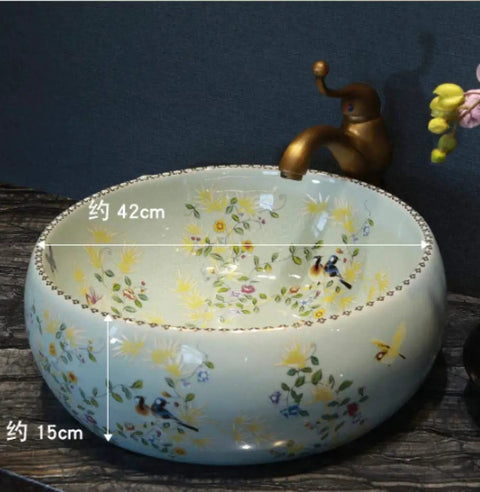 Bathroom Vessel Sink, Countertop Basin Bird Kitchen Basin Sink, Ceramic Sink, round design with floral art and faucet.