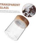 Set Of Three Airtight Glass Coffee Bean Storage Jars With Secure Screw Tops To Keep Your Loose Tea And Spice Stash Locked Down Space Saving Kitchen Pantry Canisters Gonna Love These showing transparent glass jar with wood lid.