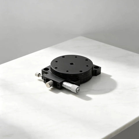 60Mm Manual Precision Rotation Stage Aluminum Platform R Shaft on a marble surface, designed for optical alignment.
