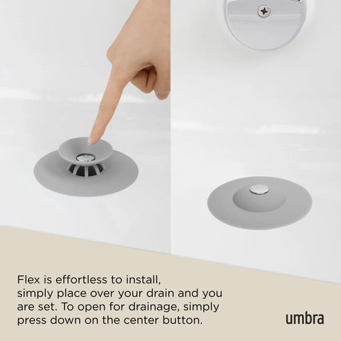 Dual Purpose Silicone Shower Drain Stopper And Hair Catcher Kills Sticky Pipe Buildup shown being pressed in a grey tone bath.