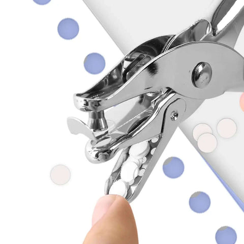 Quarter Inch Handy Hole Punch For Craft Paper And Tags, circle shape punch showing paper cutouts and finger holding tool.