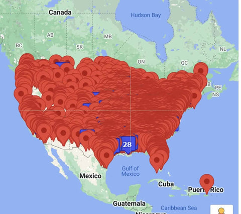 United States map densely marked with red location pins across the country