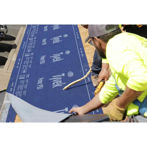 Peel And Stick Roofing Underlayment Ice Dam Blocker Tough As Nails being applied on a sloped roof by a contractor.