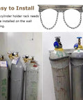 Wall Mount Steel Gas Cylinder Holder For Three Bottles Chain Supported Rack with four cylinders secured by chains.