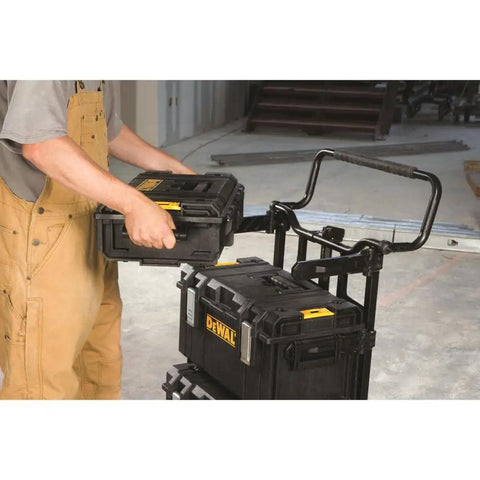 Man loading Large Tough System Tool Box With Water Seal And IP65 Rated Dust Resistant Portable Chest onto a cart.