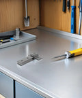 Heavy Duty Stainless Steel Shower Door Hinges With Long Bar Pivot, Double Hole Square Design For Smooth, Stable Operation And Easy Install, Built To Last For Home Renovations And New Bathroom Upgrades. Gray hinge on workbench