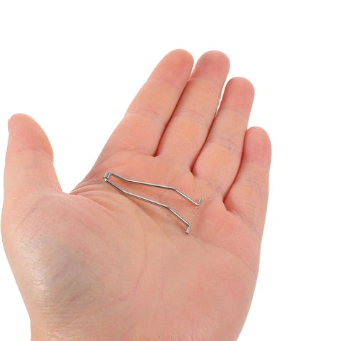 10 Pack Stainless Steel Nail Clipper Replacement Springs For Fingernail And Toenail Trimmers shown on a hand