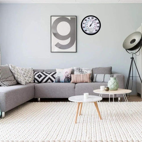 Living room with a wall-mounted Large 10 Inch Outdoor Thermometer And Hygrometer With Big Numbers No Hassle Waterproof Weather Monitor