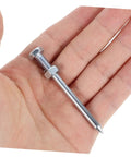 Close-up of a metal peg spike from Heavy Duty Lawn Aerator Shoes With Metal Peg Spikes 12 Pair Durable Soil Loosening Tool For Grass Aeration Promotes Healthy Root Growth And A Lush Patio And Garden held in a hand