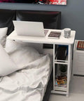 Heavy Duty Mobile Overbed Laptop Desk With Wicked Smooth Lockable Casters Reinforced Steel Build slides under bed with laptop.