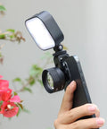 Phone Macro Lens With 10x Optical Magnification And 75mm Focal, 17mm Thread attached to smartphone near flowers